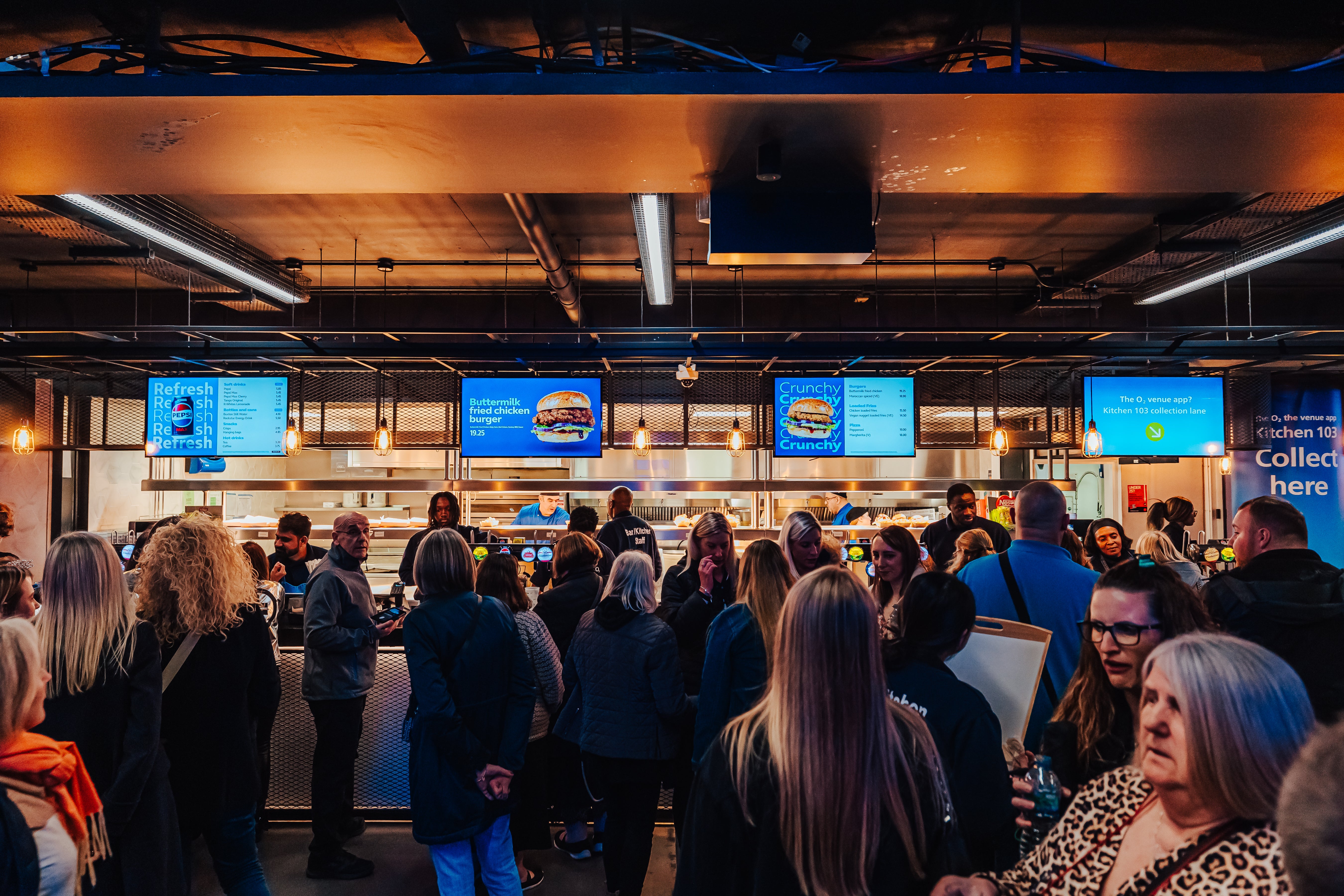 People queuing at food counter